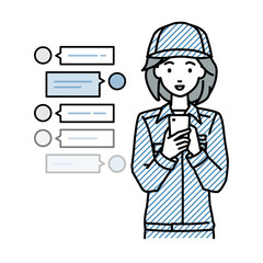 立ってスマートフォンで楽しくチャットで会話する作業員の女性