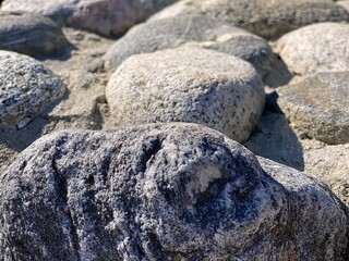 Stones in the sand abstract background 