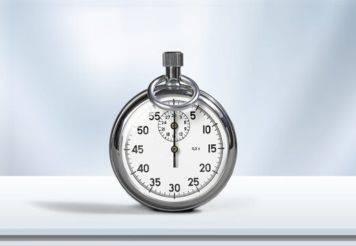 Classic metallic chrome mechanical analog stopwatch on the desk