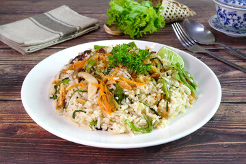 Vegetarian fried rice. Vegetarian fried rice with mixed mushroom, carrot and green vegetable. Vegetarian food