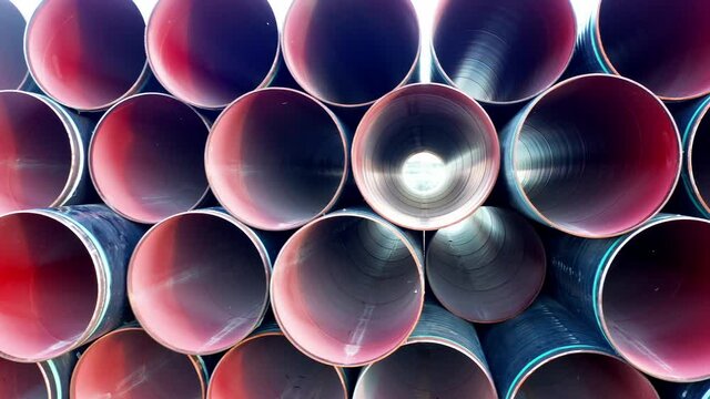 Stack of pipes for sewage or water supply system plumbing. Plastic or PVC or polythene tubes used for construction and installation of industrial drainage or distribution pipelines or sanitary sewer.