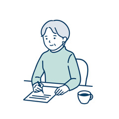 手紙を書いているシニア女性