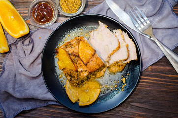 baked meat with oranges