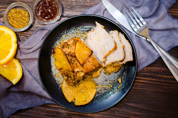 baked meat with oranges
