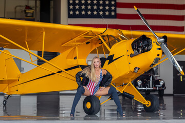 Lovely Blonde Model Posing With A Vintage World War II P-51 Mustang
