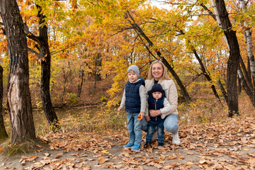 Family is resting in nature in the forest near the lake. Family member care concept. Diversity people