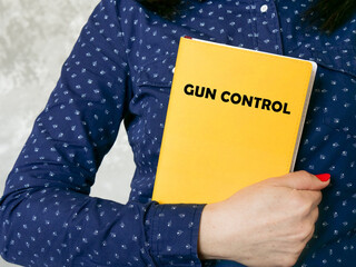 Business concept meaning GUN CONTROL with inscription on the sheet.