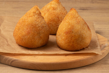 Brazilian coxinha of chicken, selective focus.