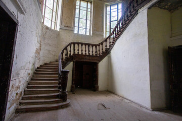 Bottom view of the wooden staircase in an old castle in light colors. High quality photo
