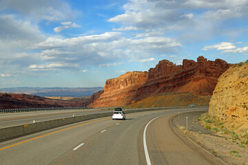 Fototapeta na wymiar The road and Black Dragon cliffs, San Rafael Swell, Utah