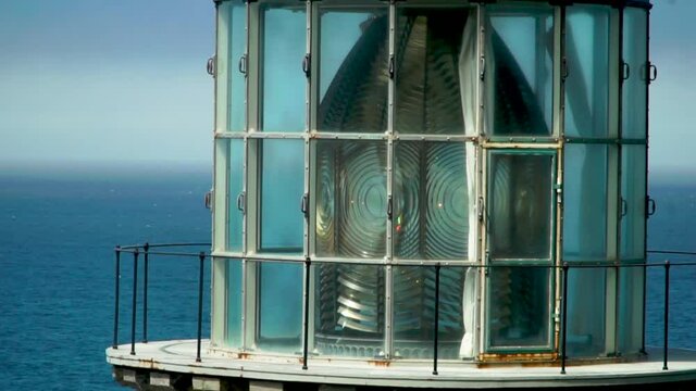 Close up view a lighthouse flashing light to warn ships of danger on the Oregon Coast.