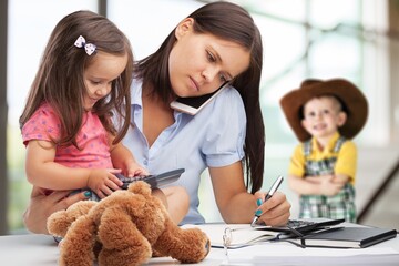 Mother working from home with kids. Quarantine during coronavirus outbreak.