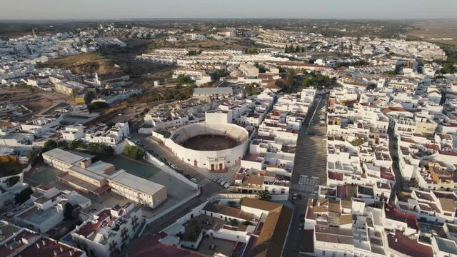 Aerial Orbiting Ayamonte cityscape white houses sprawling, Guadiana river - Huelva