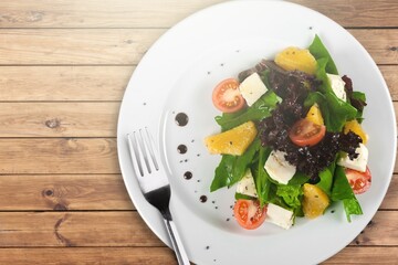 Classic tasty salad with fresh vegetables, cheese. Healthy food.