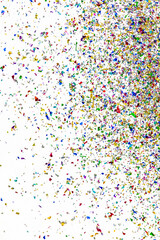Small fragments of colorful paper pieces spill out in air as beautiful celebration flakes and vivid flares to entertain and decorate party