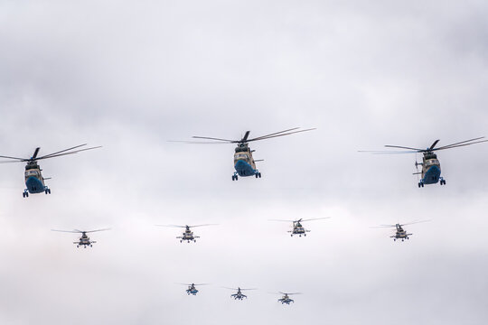 Moscow, Russia - May, 09, 2021: A group of Mi-26 transport helicopters, Mi-8 helicopters and three Mi-35 attack helicopters flies over Red Square during the parade celebrating Victory Day in Moscow