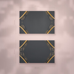 Presentable business card in black with abstract gold pattern for your personality.