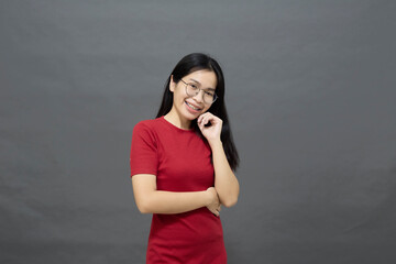 Asian woman brunette in a red dress cross arms