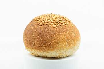 Detailed close up of a fresh baked individual wholemeal bread roll