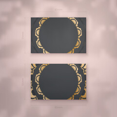 Business card template in black color with vintage gold ornaments for your business.