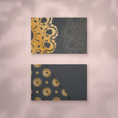 Business card template in black color with greek gold pattern for your contacts.