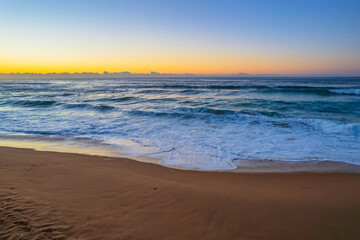 Fototapeta na wymiar Surfs up aerial sunrise seascape