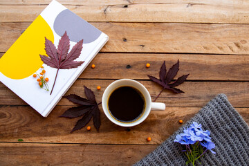 notebook planner, hot coffee espresso with mable leaf in autumn season arrangement flat lay...