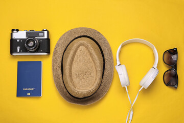 Tourist accessories on yellow background. Top view. Flat lay