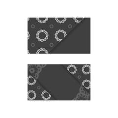 Business card in black with luxurious white ornaments for your personality.