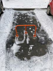 Red Car parking lock in winter day, top view