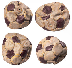 An old leather ball to play on the soccer field. Old accessories for athletes. Light background.