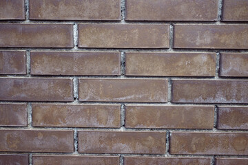 The texture of a brown brick wall. Beautiful pattern background