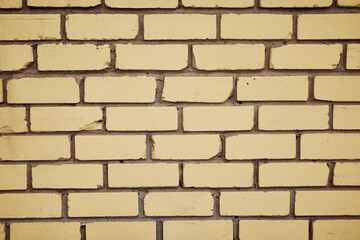 The texture of a yellow brick wall. Beautiful pattern background