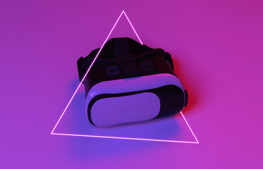 Virtual reality headset in red blue gradient neon light.