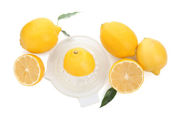 Glass squeezer and fresh lemons on white background, top view