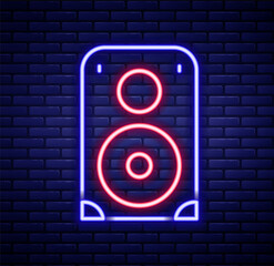 Glowing neon line Stereo speaker icon isolated on brick wall background. Sound system speakers. Music icon. Musical column speaker bass equipment. Colorful outline concept. Vector