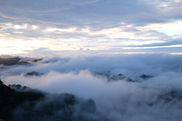 Obraz na płótnie Canvas Beautiful mountain sunrise with sunlight and fog over northern Thailand's mountains
