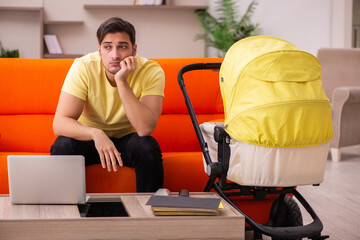Young man looking after new born at home