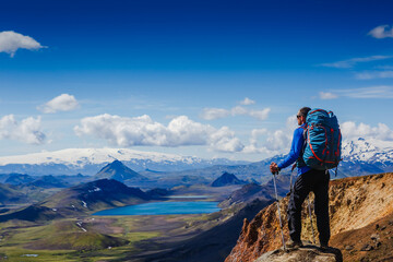 Active hiker enjoying the view on the trail in Landmannalaugar, Iceland