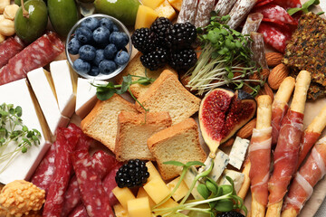 Different tasty appetizers as background, top view