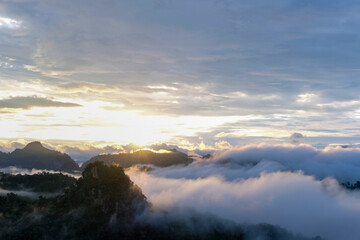 Beautiful mountain sunrise with sunlight and fog over northern Thailand's mountains