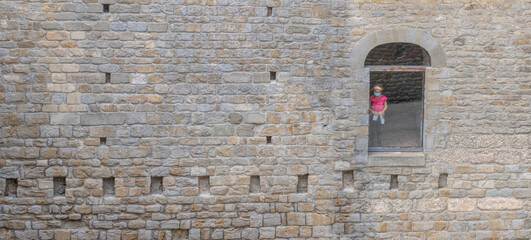 young girl trapped behind glass