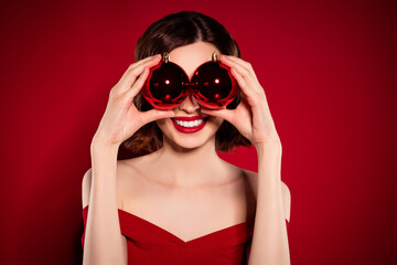 Photo of cheerful fancy model lady tender cover eyes balls christmas isolated on maroon red color...