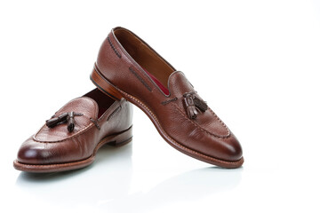 Footwear Concepts. Pair of Traditional Formal Stylish Brown Pebble Grain Tassel Loafer Shoes On...