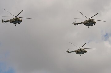 Fototapeta premium A group of multi-purpose Mi-8AMTSh helicopters in the sky over Moscow's Red Square during the dress rehearsal of the Victory Air Parade