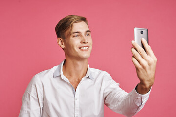 portrait of a man with a phone in hand fashion posing studio lifestyle