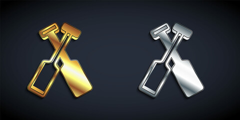 Gold and silver Crossed oars or paddles boat icon isolated on black background. Long shadow style. Vector