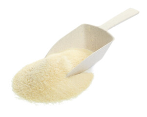 Pile of gelatin powder and scoop on white background