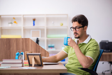 Young male designer working in the office