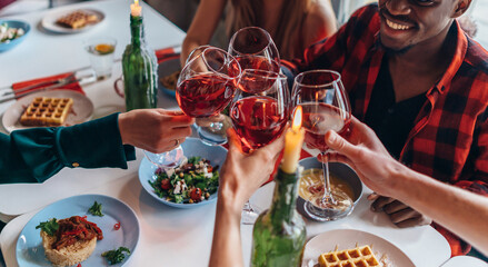 Friends Sitting Around Table Having Dinner Party